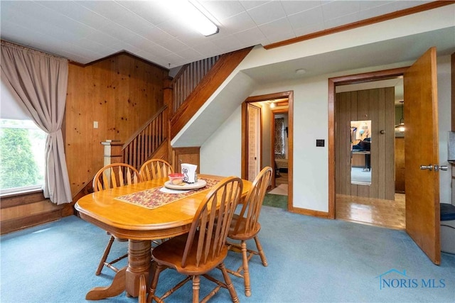 344 E Findlay St, Sugar Creek Township, OH 45893 - dining area with carpet, wood walls, stairs, ornamental molding, and baseboards