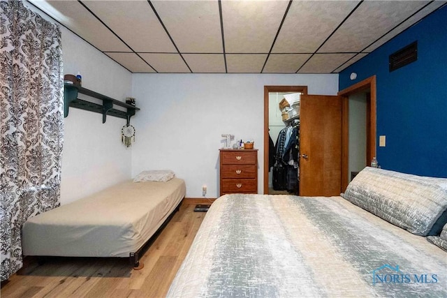 344 E Findlay St, Sugar Creek Township, OH 45893 - bedroom featuring light wood-type flooring, a spacious closet, a paneled ceiling, and a closet