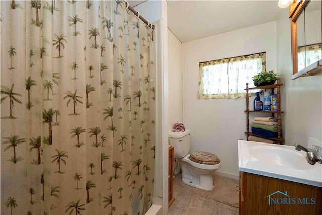 344 E Findlay St, Sugar Creek Township, OH 45893 - bathroom featuring vanity, toilet, curtained shower, and baseboards