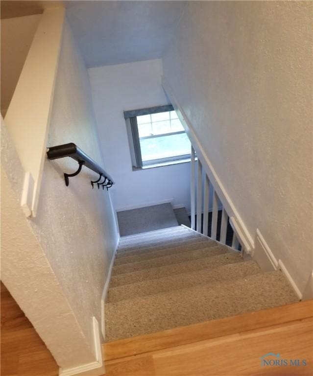5502 Rudyard Rd, Sylvania, OH 43560 - staircase featuring wood finished floors