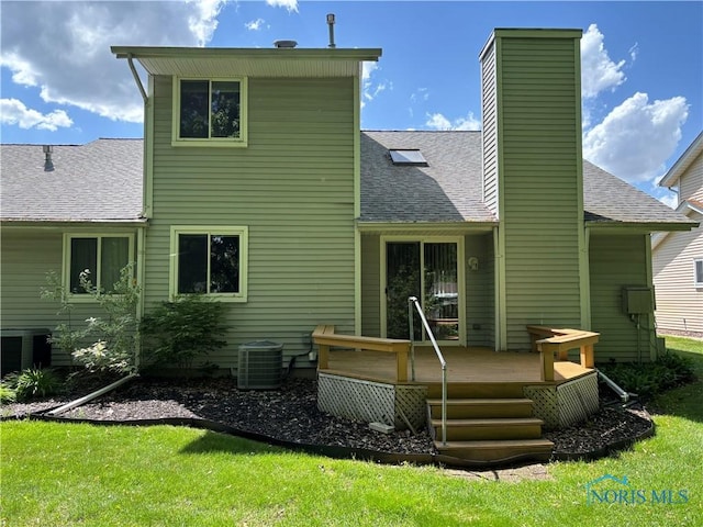 6955 Dorr St Unit 56, Toledo, OH 43615 - rear view of house with roof with shingles, a wooden deck, a chimney, central AC, and a yard