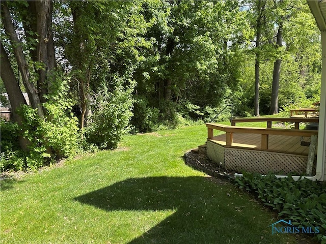 6955 Dorr St Unit 56, Toledo, OH 43615 - view of grassy yard featuring a deck