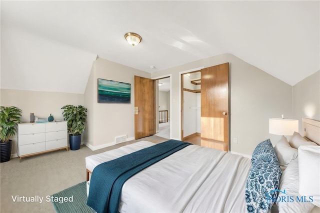 259 W Elm St, Wauseon, OH 43567 - carpeted bedroom with lofted ceiling and baseboards