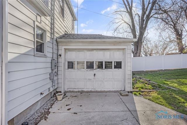 259 W Elm St, Wauseon, OH 43567 - garage featuring fence and concrete driveway