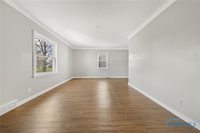 259 W Elm St, Wauseon, OH 43567 - unfurnished room featuring crown molding, wood finished floors, and baseboards