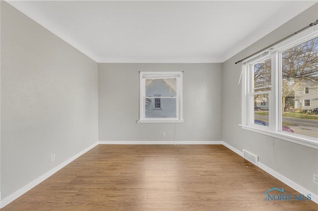 259 W Elm St, Wauseon, OH 43567 - empty room featuring wood finished floors and baseboards