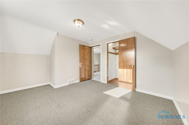 259 W Elm St, Wauseon, OH 43567 - bonus room with vaulted ceiling, baseboards, and carpet flooring