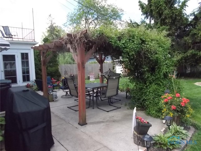 3440 Mapleway Dr, Toledo, OH 43614 - view of patio featuring outdoor dining area, grilling area, and fence