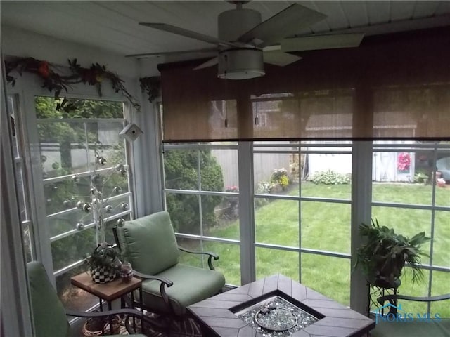 3440 Mapleway Dr, Toledo, OH 43614 - sunroom with ceiling fan, an outdoor fire pit, and healthy amount of natural light