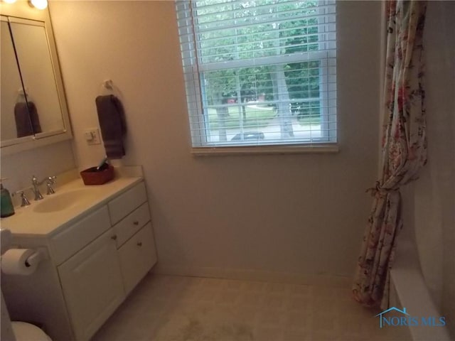 3440 Mapleway Dr, Toledo, OH 43614 - bathroom featuring vanity, a shower with curtain, and baseboards