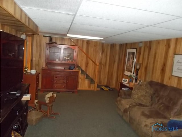 3440 Mapleway Dr, Toledo, OH 43614 - finished basement featuring wooden walls, stairs, carpet, and a paneled ceiling