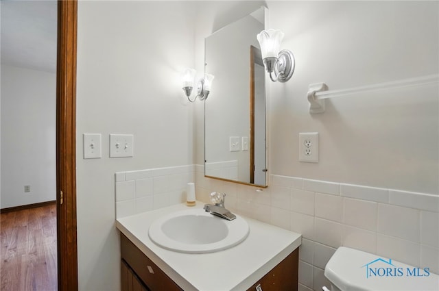 1110 Bourgogne Ave, Bowling Green, OH 43402 - bathroom with vanity, toilet, and wood finished floors