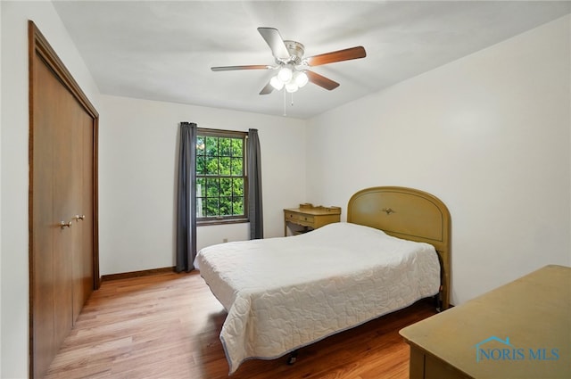 1110 Bourgogne Ave, Bowling Green, OH 43402 - bedroom featuring light wood-style flooring, a closet, baseboards, and a ceiling fan