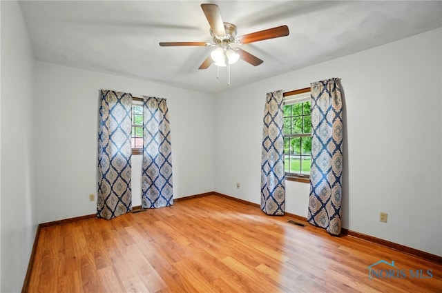 1110 Bourgogne Ave, Bowling Green, OH 43402 - unfurnished room with plenty of natural light, light wood-type flooring, and baseboards