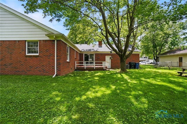 1110 Bourgogne Ave, Bowling Green, OH 43402 - view of green lawn featuring a wooden deck