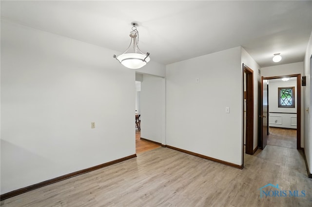 1110 Bourgogne Ave, Bowling Green, OH 43402 - empty room featuring light wood-style flooring and baseboards