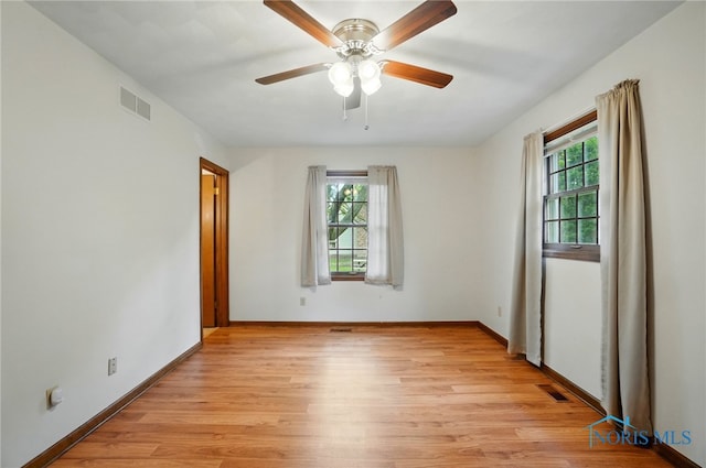 1110 Bourgogne Ave, Bowling Green, OH 43402 - unfurnished room with light wood-style flooring, baseboards, and a ceiling fan