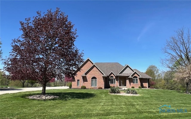 5506 Brookview Ln, Upper Sandusky, OH 43351 - view of front of house featuring a front lawn and brick siding