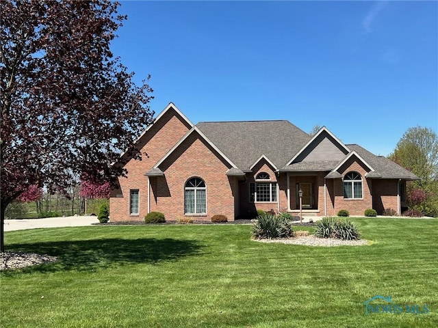 5506 Brookview Ln, Upper Sandusky, OH 43351 - ranch-style home featuring a front yard and brick siding
