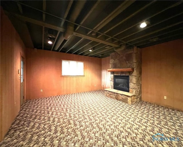 5506 Brookview Ln, Upper Sandusky, OH 43351 - below grade area featuring wood walls, a fireplace, and carpet
