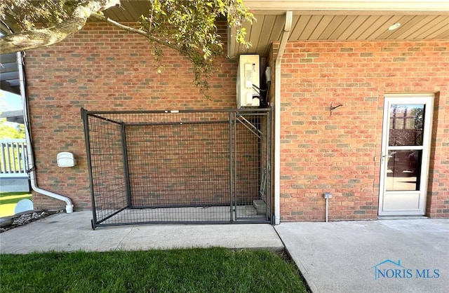 5506 Brookview Ln, Upper Sandusky, OH 43351 - view of exterior entry featuring brick siding