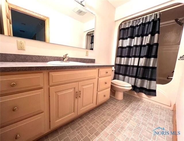 5506 Brookview Ln, Upper Sandusky, OH 43351 - bathroom with toilet, brick patterned floors, vanity, and shower / bath combo