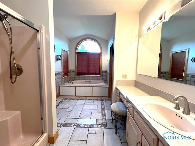 5506 Brookview Ln, Upper Sandusky, OH 43351 - bathroom with vaulted ceiling, a shower stall, vanity, and a bath
