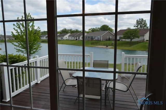1243 1st St, Findlay, OH 45840 - wooden terrace with a water view, a residential view, and outdoor dining area