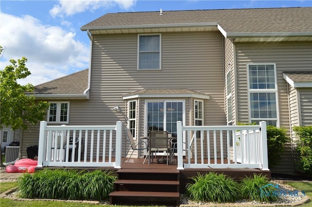1243 1st St, Findlay, OH 45840 - back of property with a deck and a shingled roof