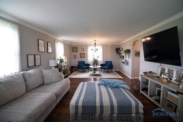100 E End Dr, Pioneer, OH 43554 - living area featuring a chandelier, ornamental molding, dark wood-type flooring, baseboards, and arched walkways