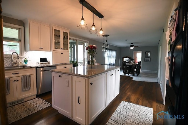 100 E End Dr, Pioneer, OH 43554 - kitchen with stainless steel dishwasher, a sink, a ceiling fan, dark countertops, and a center island