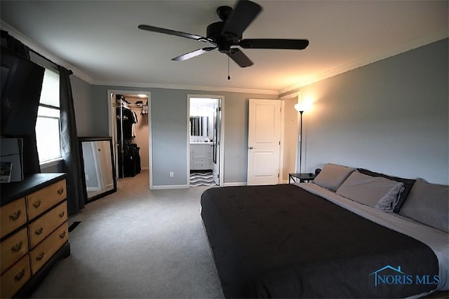100 E End Dr, Pioneer, OH 43554 - bedroom with ornamental molding, a walk in closet, carpet flooring, a closet, and ensuite bath