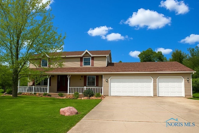 100 E End Dr, Pioneer, OH 43554 - view of front facade with concrete driveway, a garage, covered porch, and a front lawn