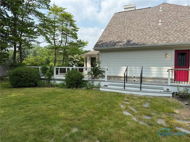 8411 Willow Glen Ct, Holland, OH 43528 - rear view of property with roof with shingles, a chimney, a yard, and a wooden deck