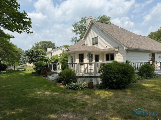 8411 Willow Glen Ct, Holland, OH 43528 - back of house featuring a lawn, roof with shingles, a chimney, and a deck