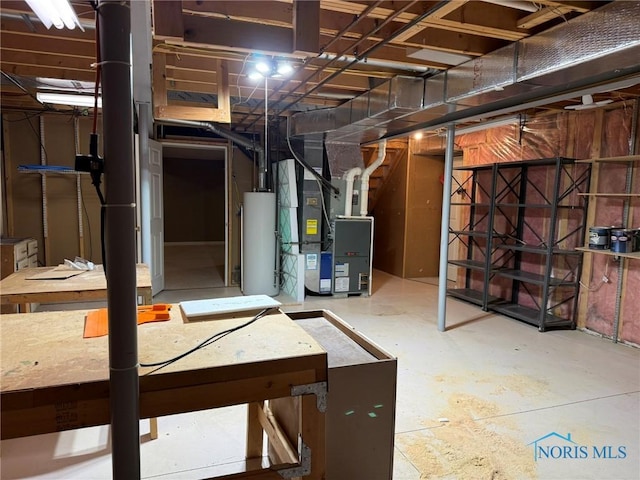 8411 Willow Glen Ct, Holland, OH 43528 - unfinished below grade area with water heater and heating unit