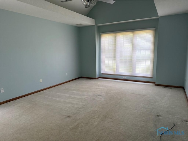 8411 Willow Glen Ct, Holland, OH 43528 - carpeted spare room with ceiling fan and lofted ceiling