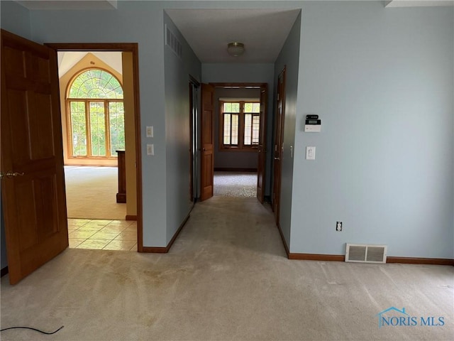 8411 Willow Glen Ct, Holland, OH 43528 - corridor with light carpet and baseboards
