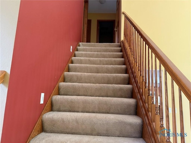 8411 Willow Glen Ct, Holland, OH 43528 - stairway featuring carpet