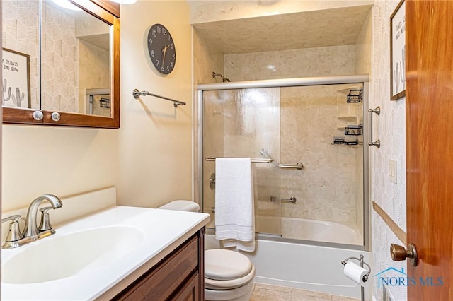4911 Claradale Rd, Toledo, OH 43614 - full bathroom with toilet, shower / bath combination with glass door, vanity, and tile patterned floors