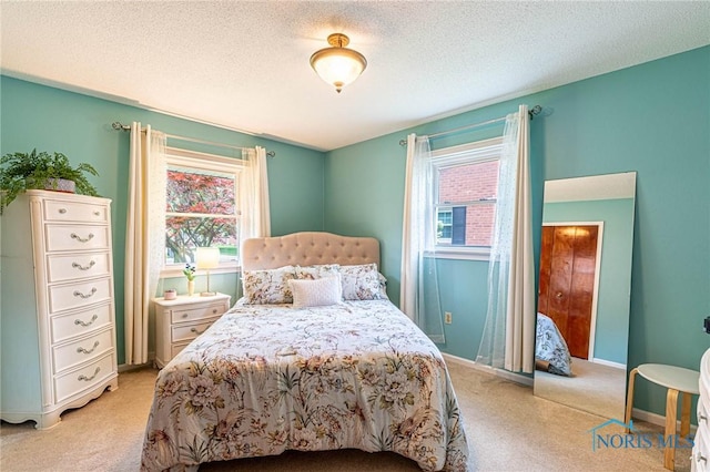 4911 Claradale Rd, Toledo, OH 43614 - bedroom with light carpet, baseboards, and a textured ceiling