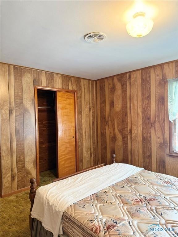 1110 Sandusky St, Fostoria, OH 44830 - carpeted bedroom with wood walls