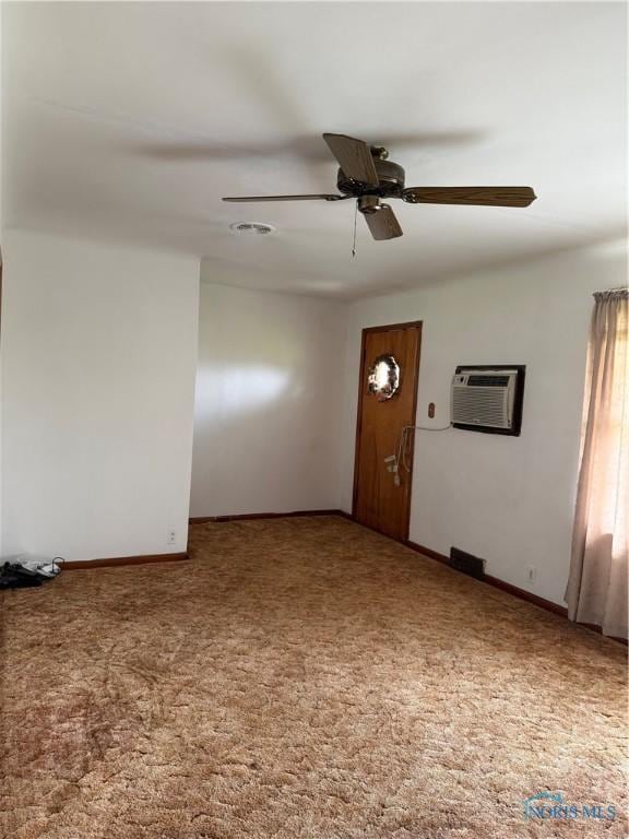 1110 Sandusky St, Fostoria, OH 44830 - unfurnished room with ceiling fan, carpet flooring, baseboards, and a wall mounted AC