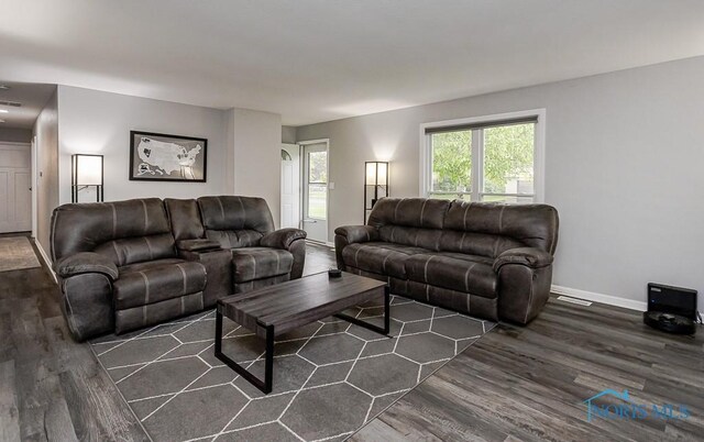 510 N Wintergarden Rd, Bowling Green, OH 43402 - living area featuring dark wood finished floors and baseboards