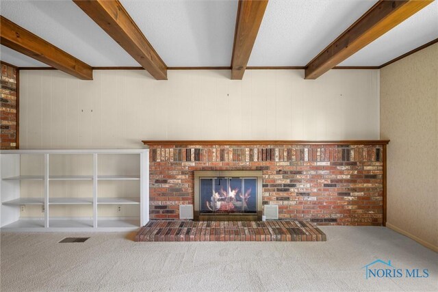 806 Woodstock Ct, Findlay, OH 45840 - detailed view of carpet flooring, a fireplace, and beamed ceiling