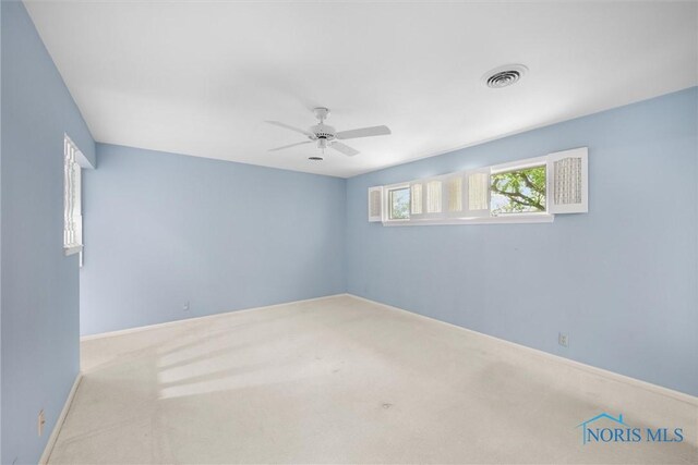 806 Woodstock Ct, Findlay, OH 45840 - carpeted empty room with ceiling fan and baseboards