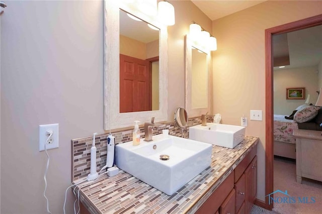 501 Flintlock Ct, Findlay, OH 45840 - bathroom featuring ensuite bath, decorative backsplash, and double vanity