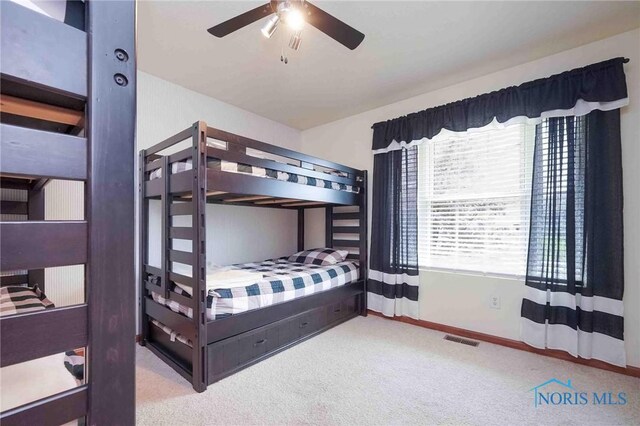 501 Flintlock Ct, Findlay, OH 45840 - carpeted bedroom with baseboards and a ceiling fan