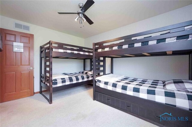 501 Flintlock Ct, Findlay, OH 45840 - bedroom featuring light carpet and ceiling fan