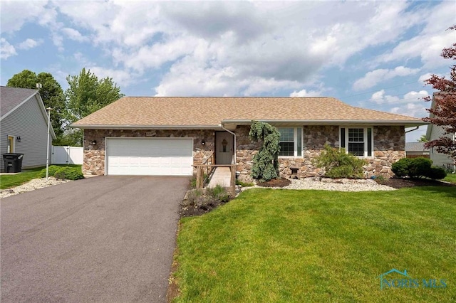 501 Flintlock Ct, Findlay, OH 45840 - single story home featuring stone siding, asphalt driveway, a garage, and a shingled roof